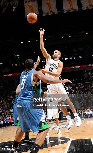 Tony Parker of the San Antonio Spurs shoots against Craig Smith of the Minnesota Timberwolves on December 23, 2008 at the AT&T Center in San Antonio,...