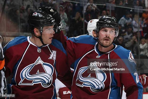 Paul Stastny of the Colorado Avalanche is congratulated by teammate Milan Hejduk after scoring a goal against the Phoenix Coyotes at the Pepsi Center...