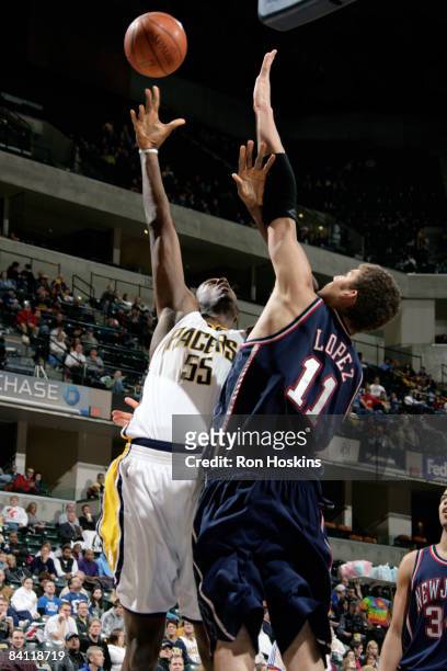 Roy Hibbert of the Indiana Pacers shoots over Brook Lopez of the New Jersey Nets at Conseco Fieldhouse December 23, 2008 in Indianapolis, Indiana....