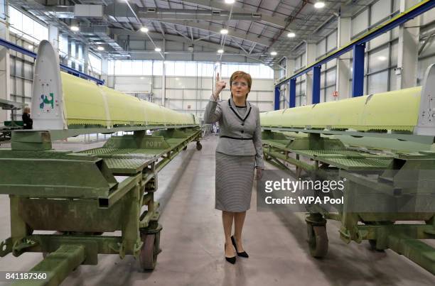 Scottish First Minister Nicola Sturgeon views aircraft wing parts being manufactured as she visits Spirit Aerospace in Prestwick, before making a...