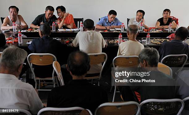 Newly elected village committee members, along with members of the Village Party Branch of the Communist Party of China, meet at a regular activity...