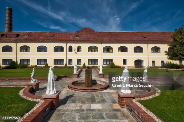 General view from the courtyard of Herend Porcelain with the old kiln on the left is seen on August 31, 2017 in Veszprem, Hungary. Herend Porcelain...