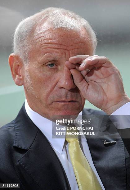 Thailand's football coach Peter Reid reacts during his team's match against with Vietnam during their AFF Suzuki Cup 2008 football final round first...