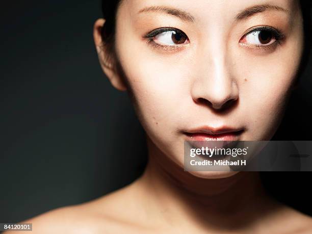 young woman is looking away, portrait, close-up - at a glance ストックフォトと画像