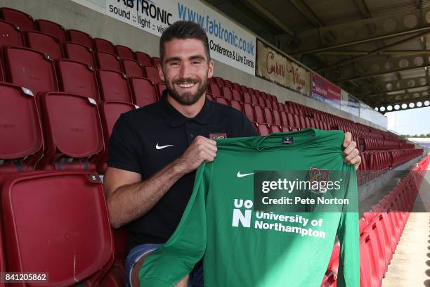 Northampton Town new signing Matt Ingram poses with a shirt during a photo call at Sixfields on August 31, 2017 in Northampton, England.