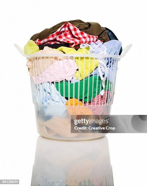 basket of dirty washing in laundry basket - laundry basket foto e immagini stock