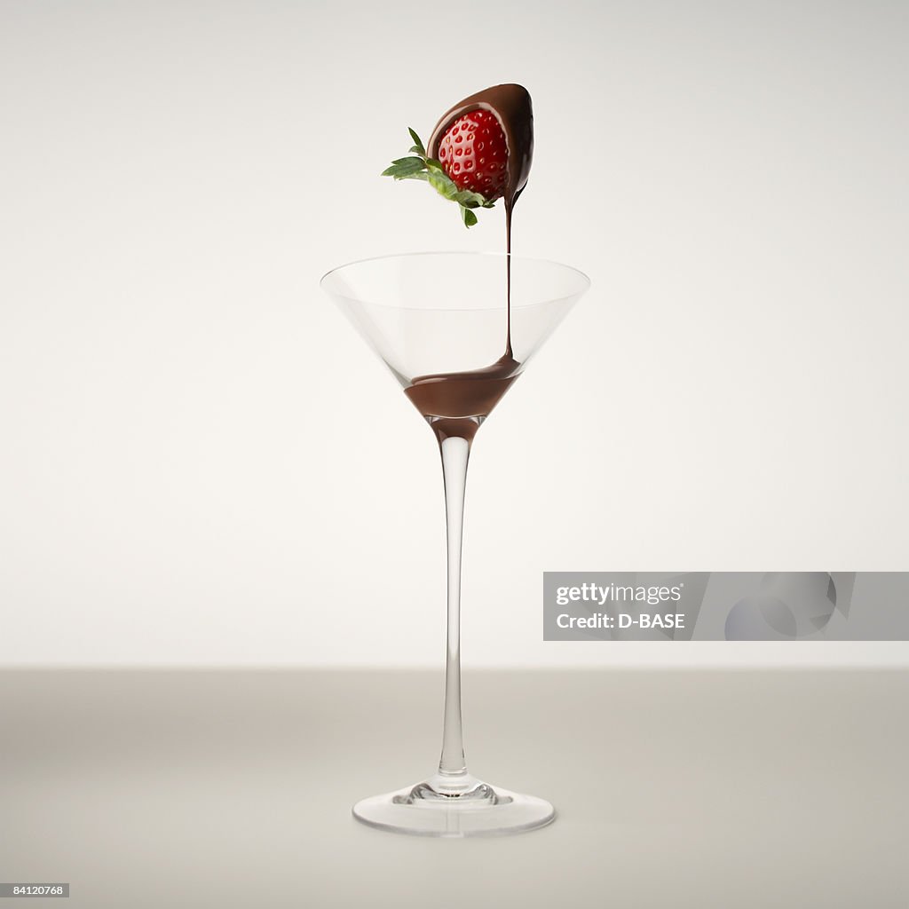 Melted chocolate running off a strawberry