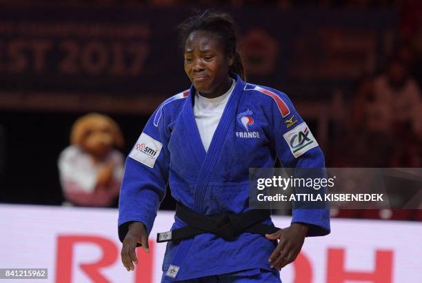 Gold medalist France's Clarisse Agbegnenou celebrates her victory against Slovenia's Tina Trstenjak during their final match in the womens -63kg...