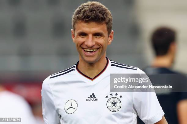 Thomas Mueller smiles during a Germany training session at Eden Arena ahead of their FIFA World Cup Russia 2018 Group C Qualifier against Czech...