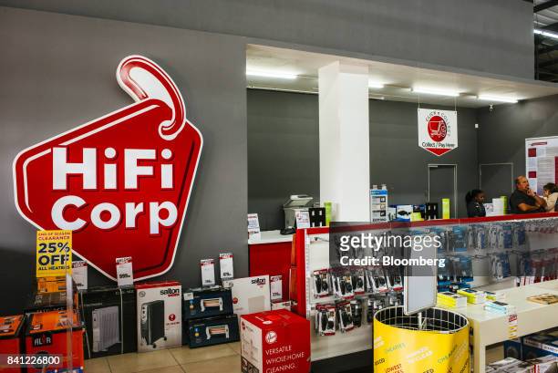 Electrical goods and accessories sit on display near the sales desk of a HiFi Corp. Store, operated by Steinhoff International Holdings NV, in...