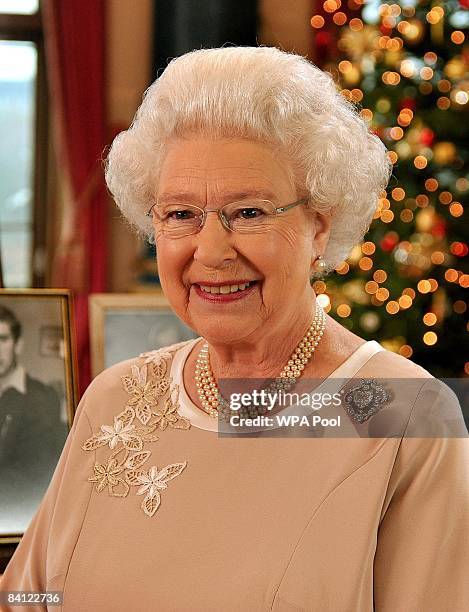 Queen Elizabeth II stands in the music room of Buckingham Palace after recording her Christmas day message to the Commonwealth on December 22, 2008...