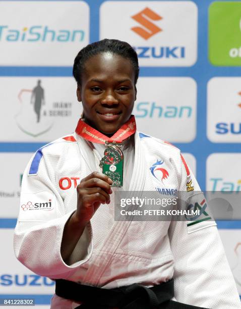 France's Clarisse Agbegnenou, Gold medalist of the womens -63kg category celebrates with her medal on the podium during the medal ceremony at the...