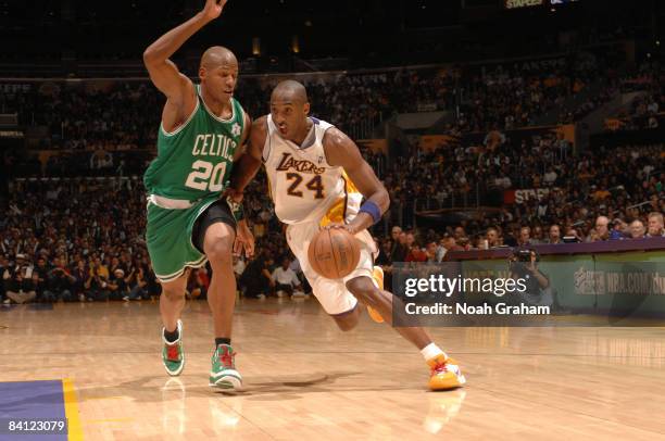 Kobe Bryant of the Los Angeles Lakers dribbles to the basket against Ray Allen of the Boston Celtics at Staples Center on December 25, 2008 in Los...