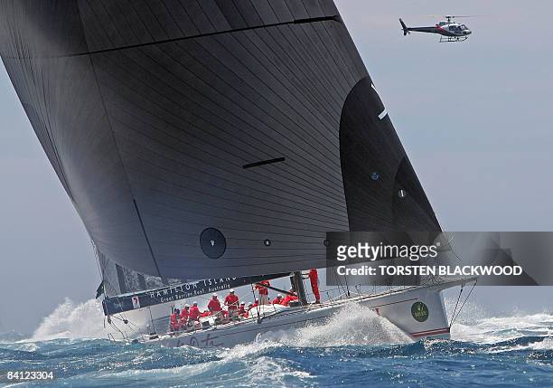 Local supermaxi and three-time line honours winner, 'Wild Oats XI', leads the fleet of 110 boats out of Sydney Harbour after the start of the annual...