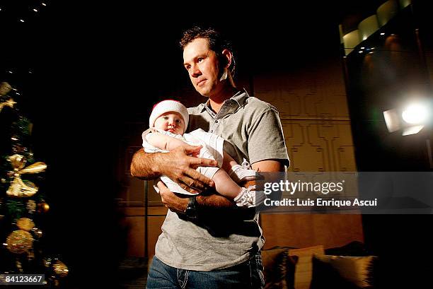 Ricky Ponting poses with his daughter Emmy during the Australian cricket team's Christmas lunch at Crown Towers on December 25, 2008 in Melbourne,...