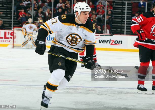 Milan Lucic of the Boston Bruins skates against the New Jersey Devils at the Prudential Center on December 23, 2008 in Newark, New Jersey. The Bruins...