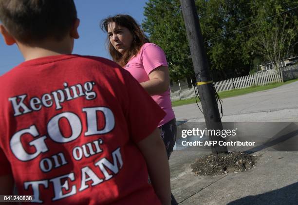 Explosion evacuee Martha Higdon and her son Truman speaks outside of the First Baptist Church which has been set up as a shelter for residents...