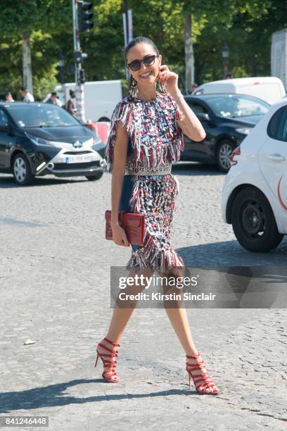 Luna de Casanova wears a Chanel dress, Azzedine Alaia belt, Hermes bag and Gianvito Rossi shoes day 3 of Paris Haute Couture Fashion Week...