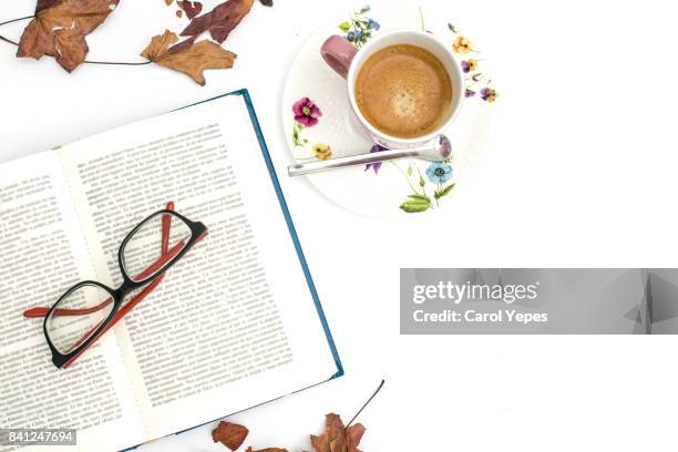 overhead shot open book and coffee with autumn leaves - open book stock-fotos und bilder