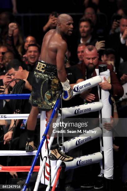 Floyd Mayweather Jr. Celebrates after his TKO of Conor McGregor in their super welterweight boxing match on August 26, 2017 at T-Mobile Arena in Las...