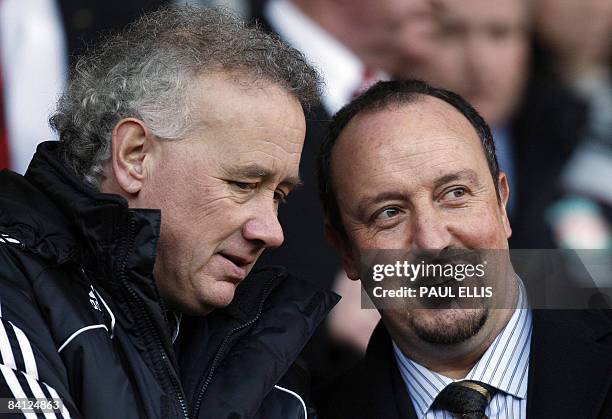 Liverpool 's Spanish manager Rafael Benítez joins club Chief Executive Rick Parry in the directors box before taking on Bolton Wanderers in their...