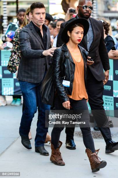 Actor Anson Mount and Darah Trang leave the "AOL Build" taping at the AOL Studios on August 31, 2017 in New York City.