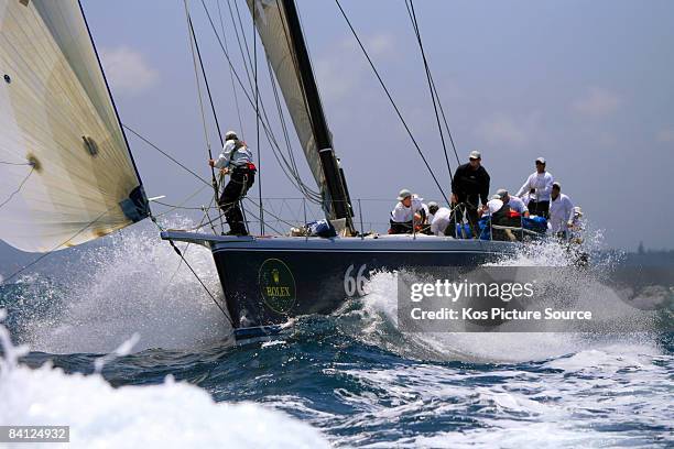 The bowman adjusts the tackline on Black Jack as she passes The Heads at the start of the Rolex Sydney to Hobart, on Boxing Day December 26, 2008 in...