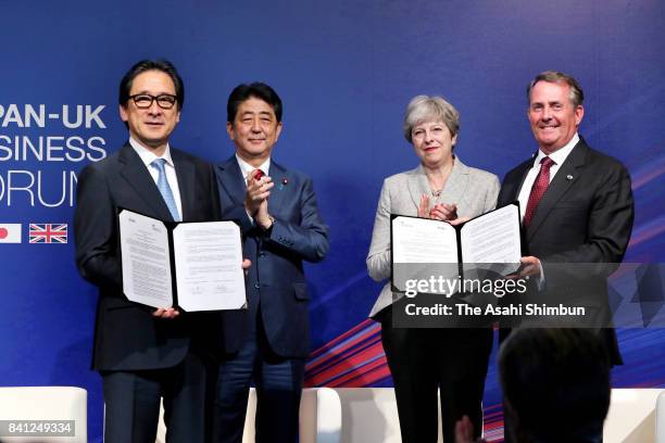 Japan External Trade Organisation chairman Hiroyuki Ishige, Japanese Prime Minister Shinzo Abe, British Prime Minister Theresa May and International...