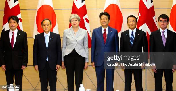 Defense Minister Itsunori Onodera, Chief Cabinet Secretary Yoshihide Suga, British Prime Minister Theresa May, Japanese Prime Minister Shinzo Abe,...