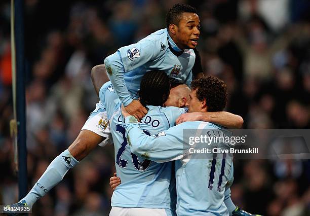 Robinho of Manchester City celebrates with teammate Felipe Caicedo after he has scored the second goal during the Barclays Premier League match...