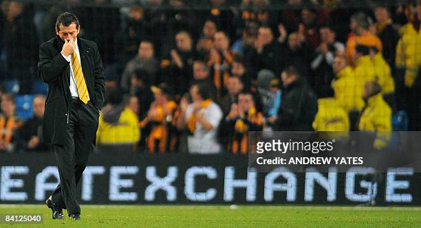 Hull City manager Phil Brown leaves the pitch after being beaten 5-1 by Manchester City during the English Premier league football match at The City...