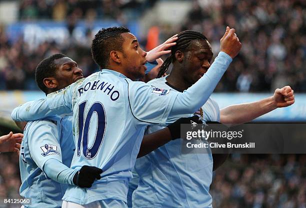 Felipe Caicedo of Manchester City celebrates with teammates Robinho and Shaun Wright-Phillips after he scored the first goal during the Barclays...