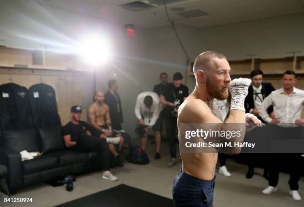 Conor McGregor warms up in his locker room prior to his super welterweight boxing match against Floyd Mayweather Jr. On August 26, 2017 at T-Mobile...