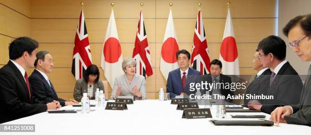 Defense Minister Itsunori Onodera, Chief Cabinet Secretary Yoshihide Suga, British Prime Minister Theresa May, Japanese Prime Minister Shinzo Abe,...