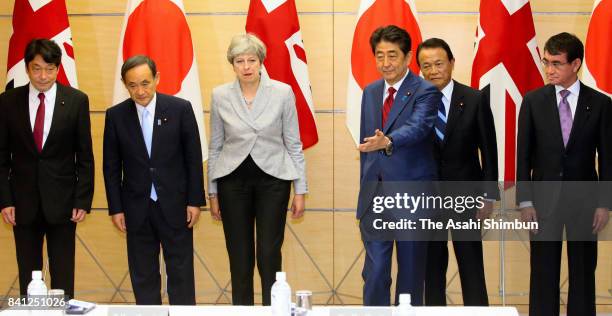 Defense Minister Itsunori Onodera, Chief Cabinet Secretary Yoshihide Suga, British Prime Minister Theresa May, Japanese Prime Minister Shinzo Abe,...