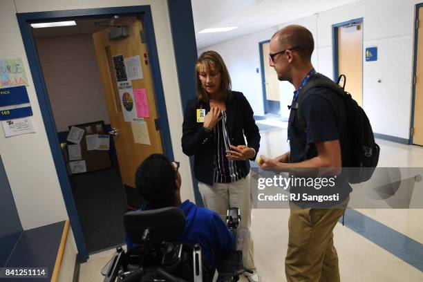 Wheat Ridge High School's nurse Rhonda Valdez, center, was recently hired with a grant where Colorado schools are splitting $9.2 million in grant...