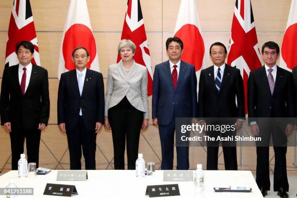 Defense Minister Itsunori Onodera, Chief Cabinet Secretary Yoshihide Suga, British Prime Minister Theresa May, Japanese Prime Minister Shinzo Abe,...