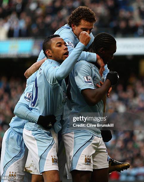 Felipe Caicedo of Manchester City celebrates with teammates Robinho and Elano after he has scored the first goal during the Barclays Premier League...