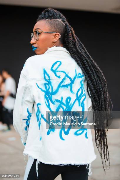 Visitor poses , fashion detail hairstyle and jeans jacket during Sao Paulo Fashion Week N44 SPFW Winter 2018 at Ibirapuera's Bienal Pavilion on...