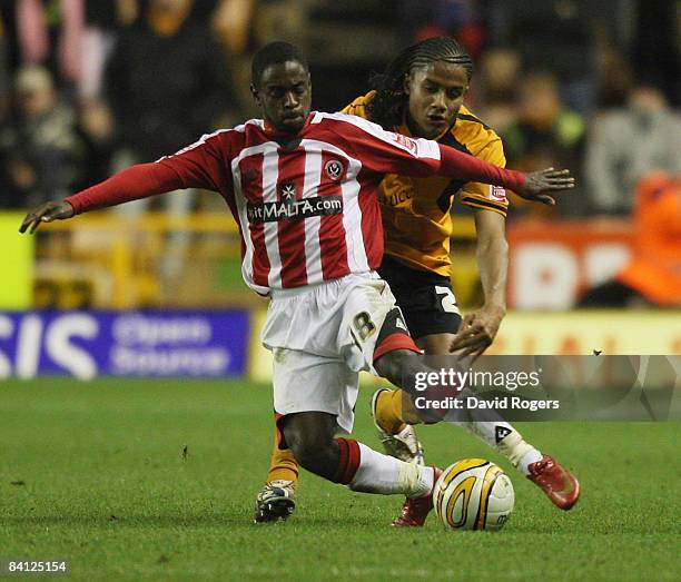 Michael Mancienne of Wolves tackles Nathan Dyer during the Coca-Cola Championship match between Wolverhampton Wanderers and Sheffield United at...