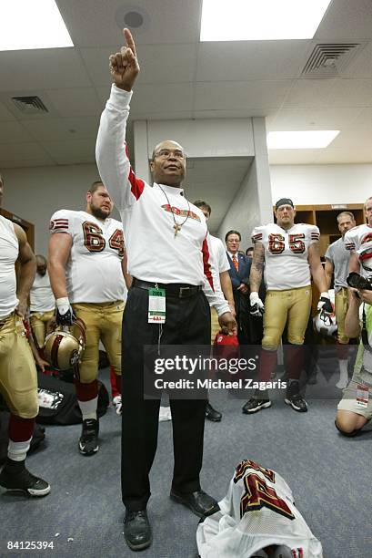 Head coach Mike Singletary of the San Francisco 49ers celebrates in the locker room after the NFL game against the St. Louis Rams at the Edward Jones...