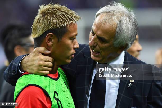 Head coach Vahid Halilhodzic of Japan talks to Keisuke Honda after his team's 2-0 victory and qualified for the FIFA World Cup Russia after the FIFA...
