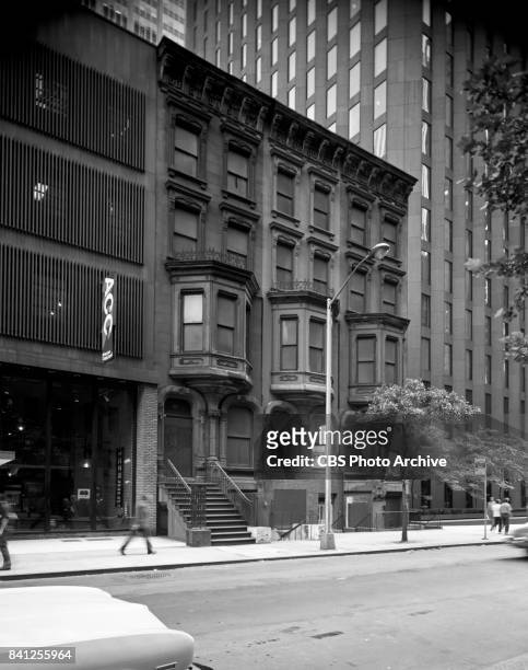 Exterior photograph of low rise buildings adjacent to CBS headquarters, "Black Rock" in New York City. This frame shows a four story tall tenement...