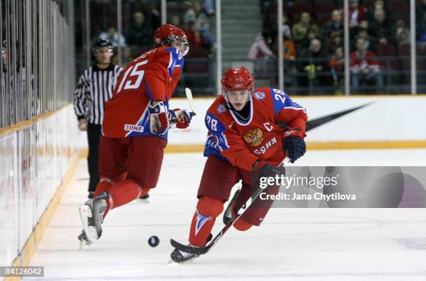 Nikita Filatov of Russia skates with the puck as team mate Evgeni Grachev looks on at the Civic Centre on December 26, 2008 in Ottawa, Ontario,...