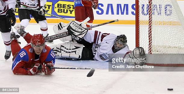 Nauris Enkuzens of Latvia and the player of the game for Latvia stretches out to stop a shot from Sergei Andronov of Russia at the Civic Centre on...