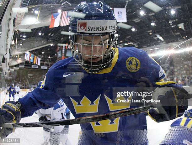 Tim Erixon of Sweden braces himseld against the boards in a game against Finland at the Civic Centre on December 26, 2008 in Ottawa, Ontario, Canada.