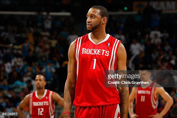 Tracy McGrady, Rafer Alston and Yao Ming of the Houston Rockets wait during a timeout against the New Orleans Hornets on December 26, 2008 at the New...