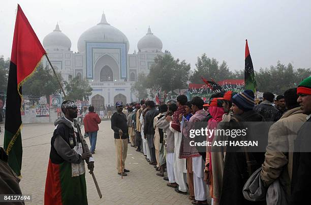 Supporters gather as they arrive for prayer for slain former Pakistani premier Benazir Bhutto on her first death anniversary in Garhi Khuda Bakhsh on...