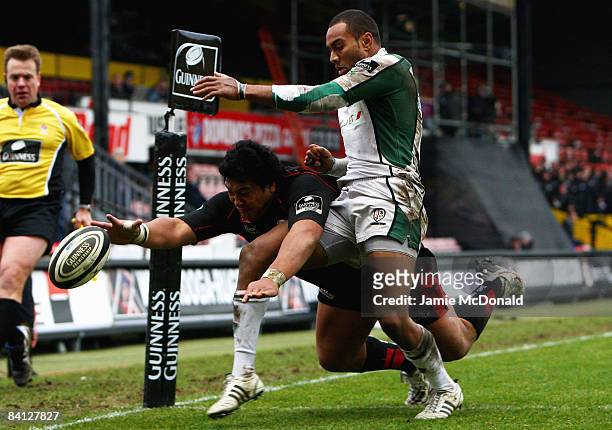Sailosi Tagicakibau of London Irish does enough to stop Cencus Johnston of Saracens from scoring a try during the Guinness Premiership match between...