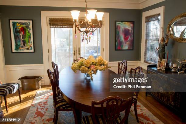 Actress Christine Ebersole's home is photographed for Closer Weekly Magazine on April 14, 2016 in New Jersey. Dining room; artwork on the wall is...